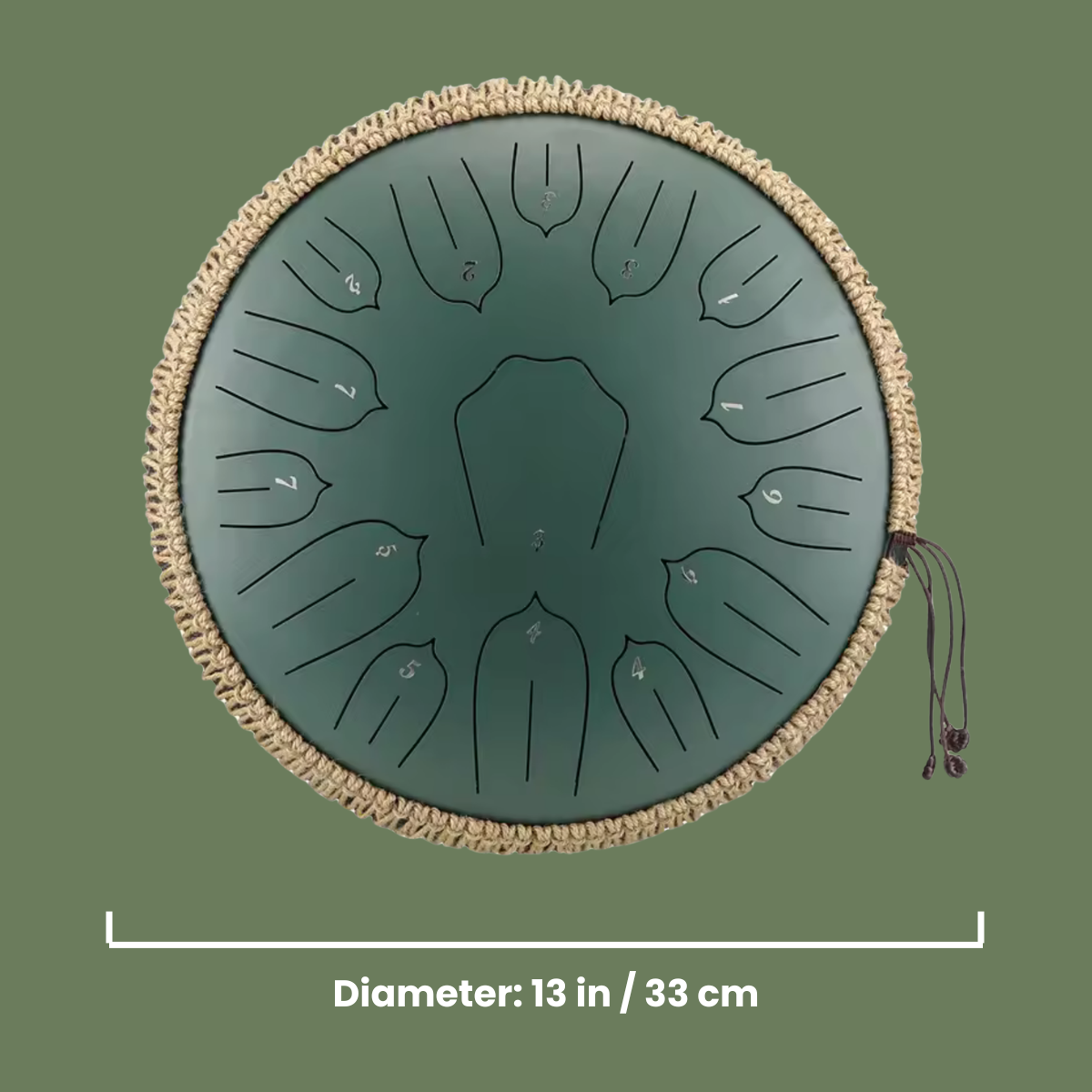 Green steel tongue drum with beige rim on a green background